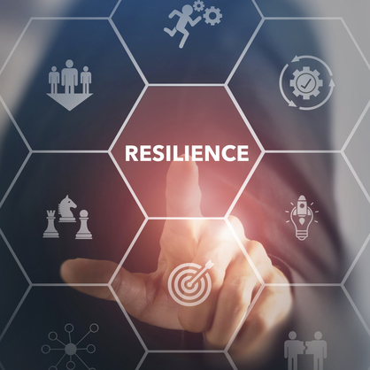 finger pushing button that says resilience